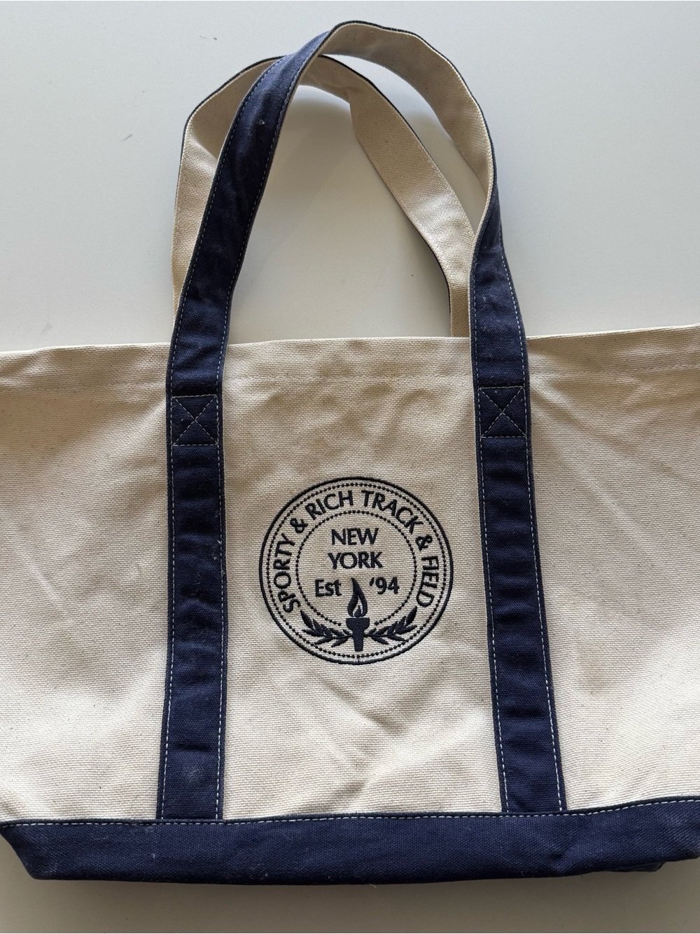 Sporty & Rich Cream Canvas Tote with Navy Trim and Logo
